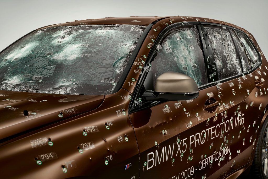 A police car is not armored as law enforcement prioritizes cost and performance, while an armored vehicle and bulletproof glass are kept for special units