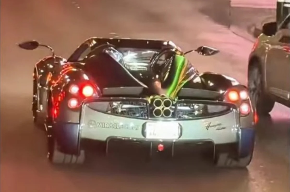 Man driving custom Any Level Ford F-450 Super Duty through Las Vegas realizes he's even stealing attention as he rolls past $5M Pagani Huayra