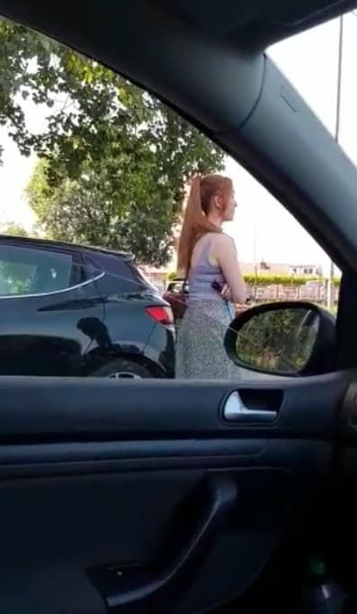 Woman tries to reserve parking space 