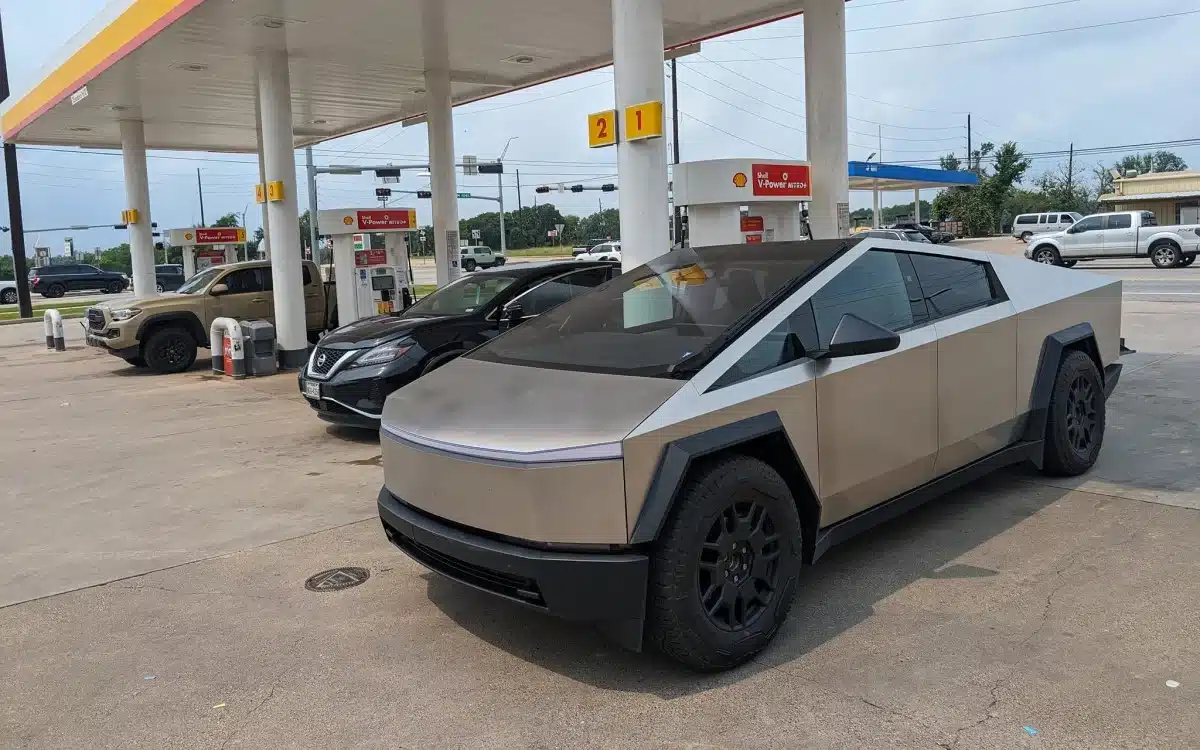People stood confused as a Tesla Cybertruck pulled into a gas station