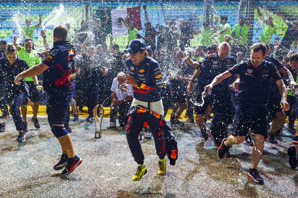 Sergio Perez celebrates F1 win in Singapore in the paddock