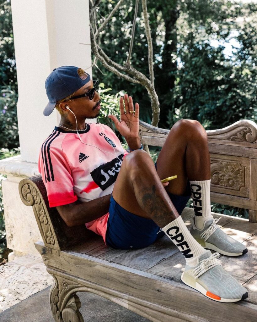 Pharrell Williams wearing his HU sneakers