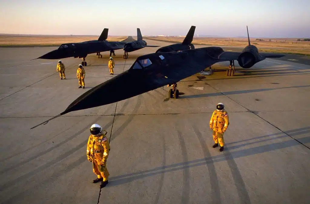 Pilots in orange jumpsuits with their Blackbird SR71 planes