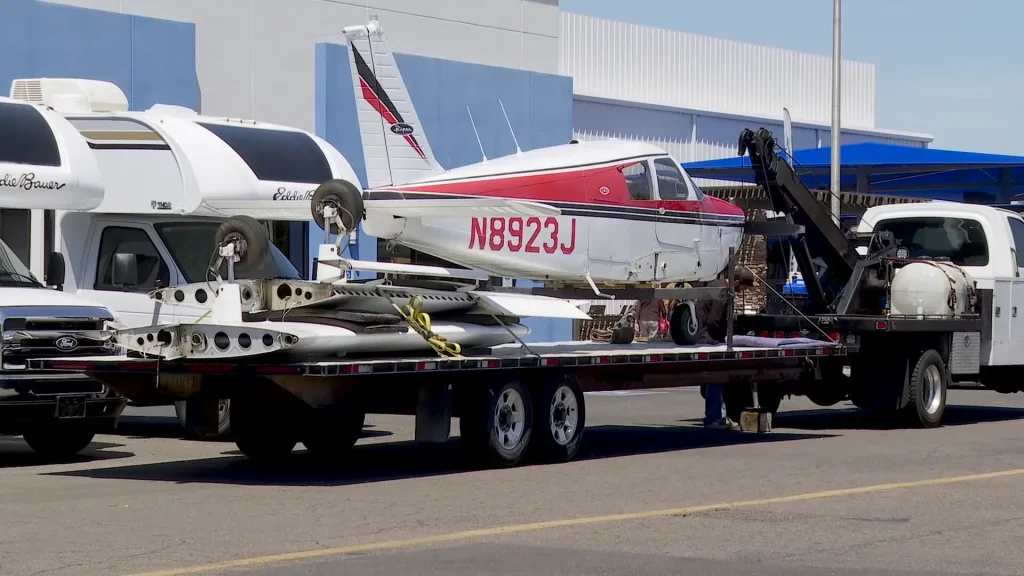 Breathtaking surveillance footage shows small Piper plane miraculously landing on a main street in Arizona