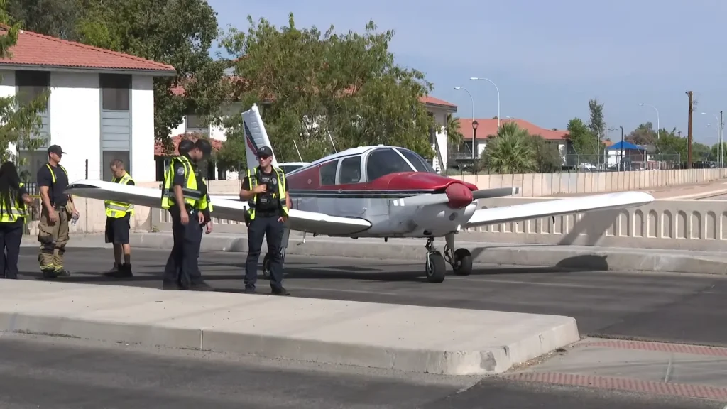 Breathtaking surveillance footage shows small Piper plane miraculously landing on a main street in Arizona