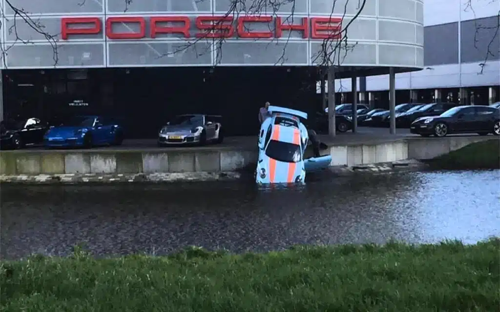 A Porsche 911 GT3 RS at a dealership in the Netherlands was found nose-first in a canal after rolling off the shop floor and nobody ever found out why