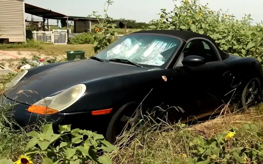 Abandoned Porsche Boxster on Facebook Marketplace was left abandoned in an overgrown field in Texas