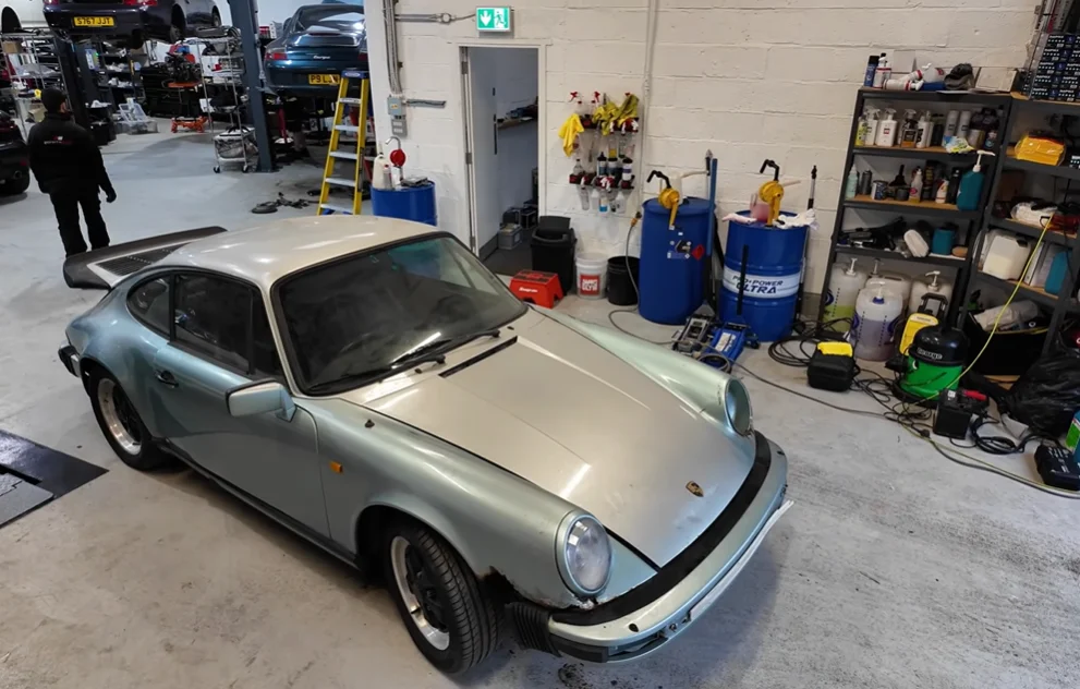Man opens shipping container to discover Porsche 911 that's been hiding for 16 years so he checks its condition