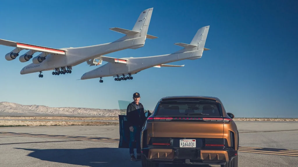 Most powerful production Porsche sets a new record after driving under world's biggest aircraft as it takes off and lands