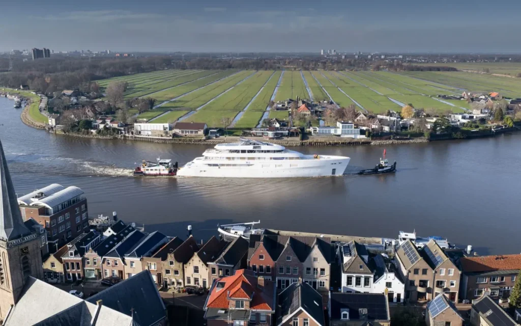 Kansas auto tycoon’s 270-foot $100m superyacht dwarfs homes as it inches beneath lifting bridge