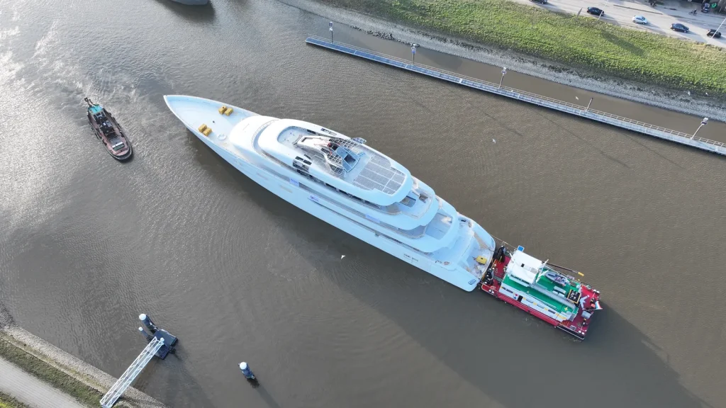 Kansas auto tycoon’s 270-foot $100m superyacht dwarfs homes as it inches beneath lifting bridge