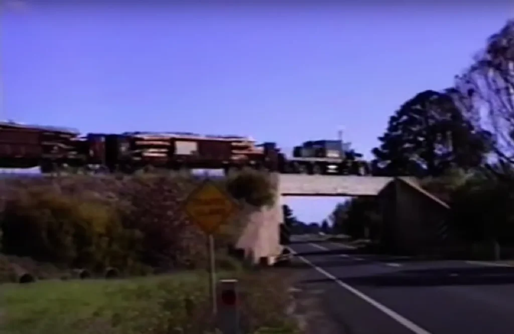 Semi-truck pulling train car