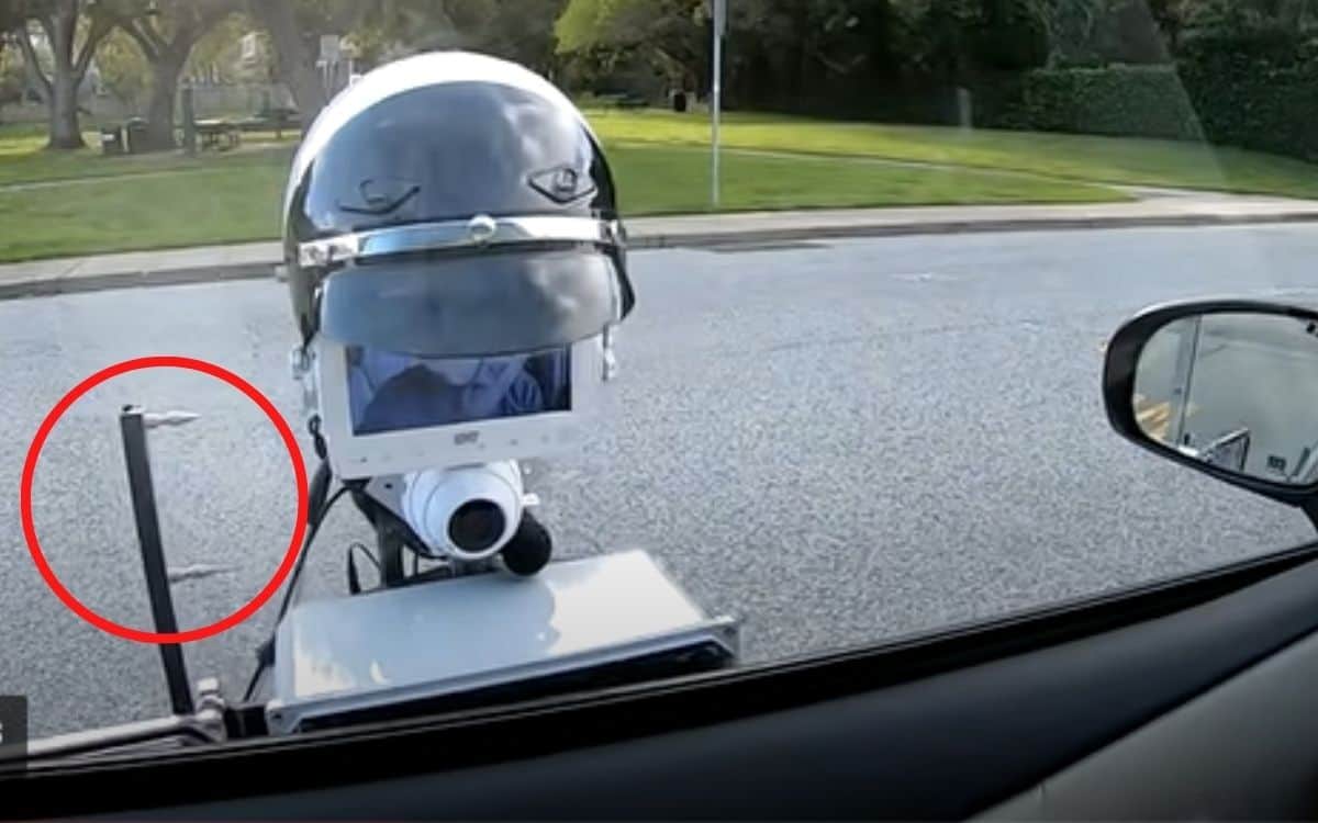 Tire spikes are highlight by a red circle on the robot cop.
