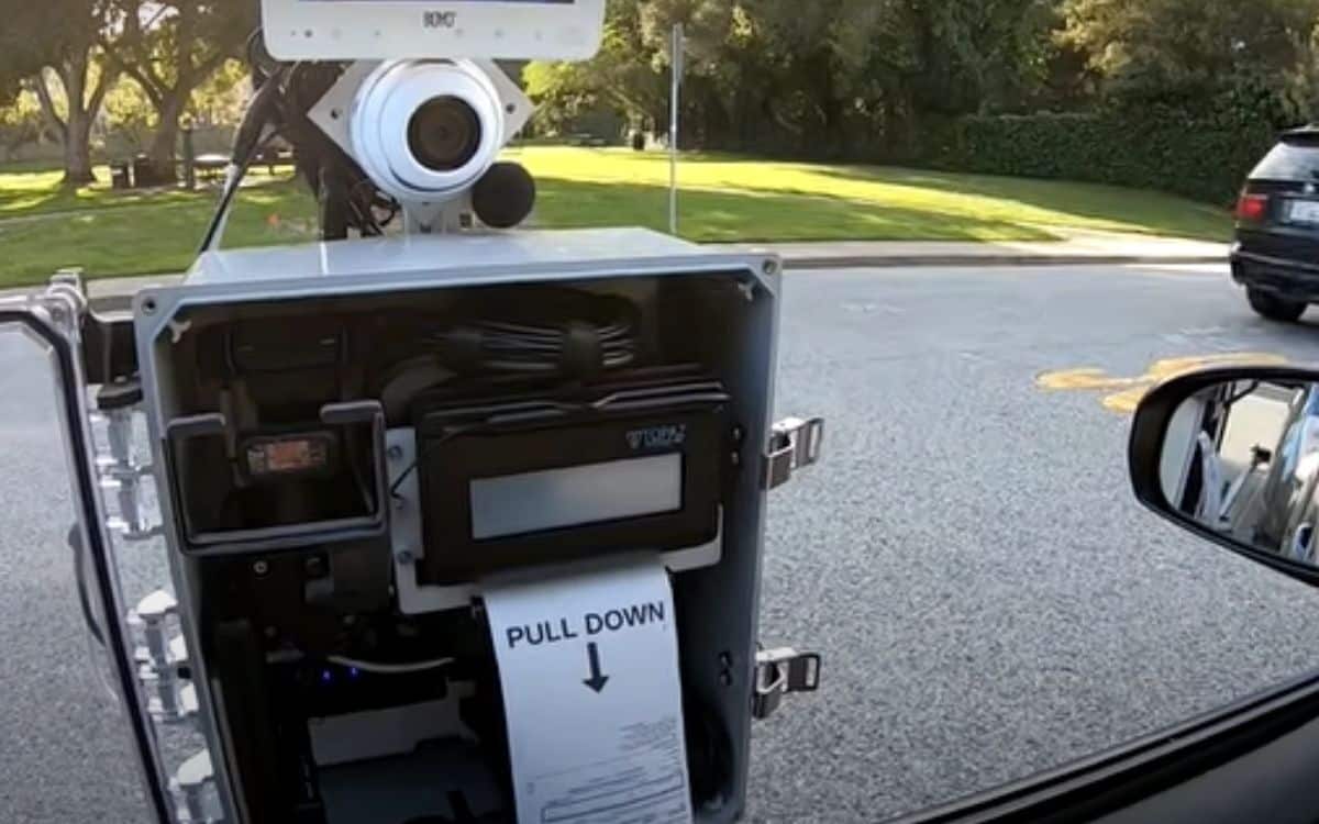 A ticket hanging from the robot cop.