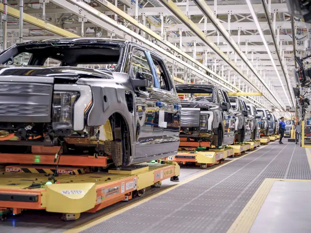 Ford model T legacy drives a Ford redesign in electric vehicles as Tesla competition forces the automaker to cut losses and rethink production