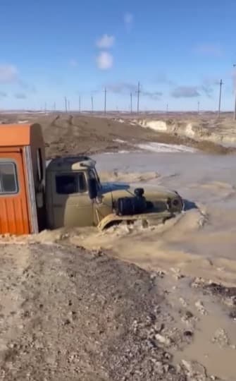 Russian bus driver, bus deep in the water