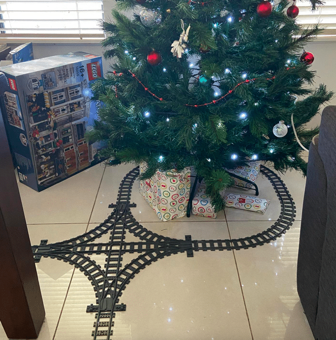 The LEGO train track winds around his home every Christmas