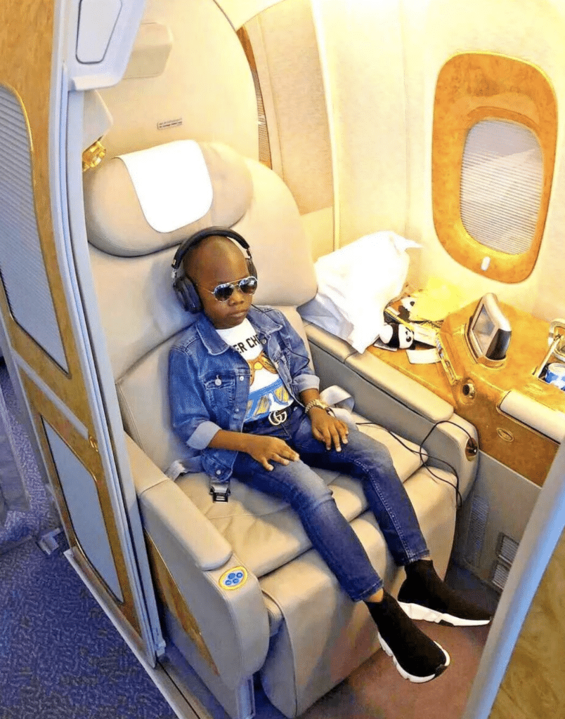 The 'world's youngest millionaire' looks very at home aboard a private jet