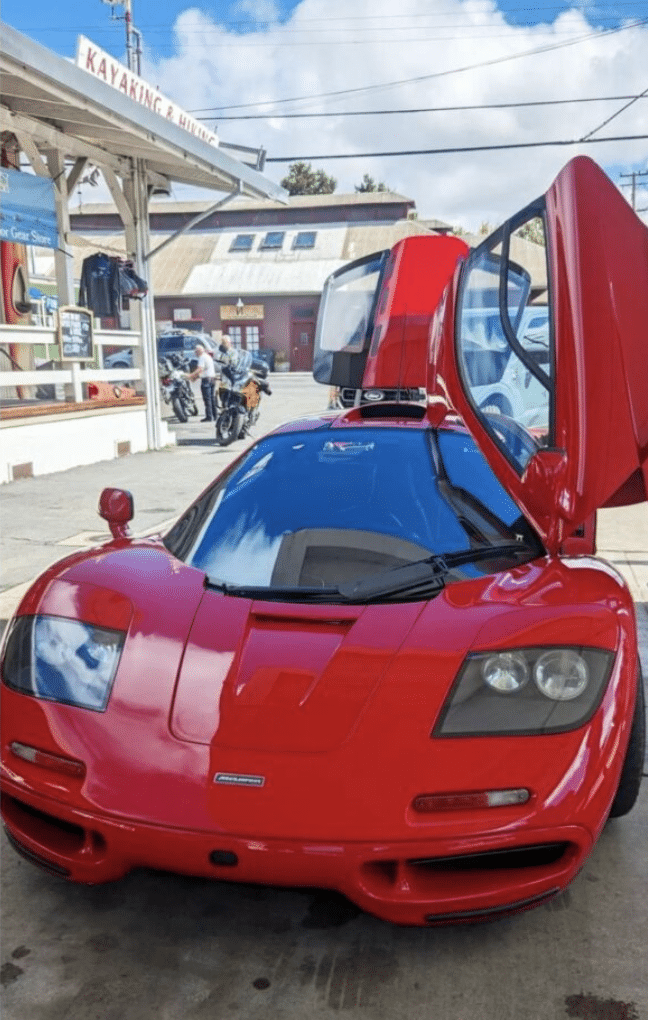 OpenAI founder and CEO Sam Altman lets a father and son take a look at his  million McLaren F1
