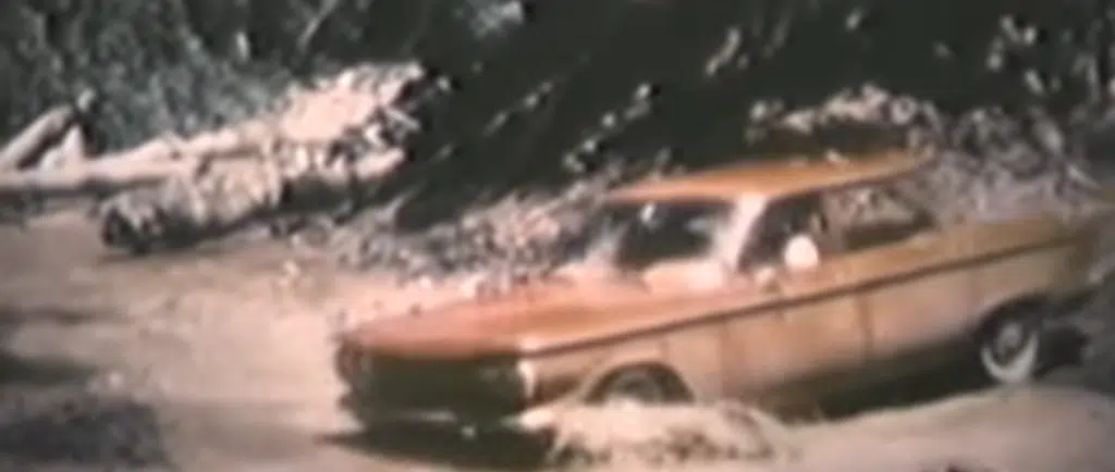 Chevrolet Corvair lies abandoned in the middle of a jungle