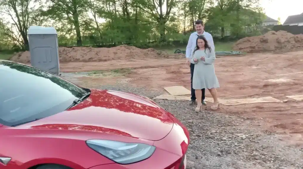 Man restores a salvage Tesla then surprises his wife with it as her new car and her reaction is one of disbelief