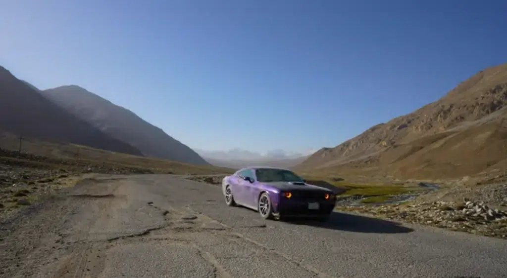 Man traveling the world in Dodge Challenger on an adventure