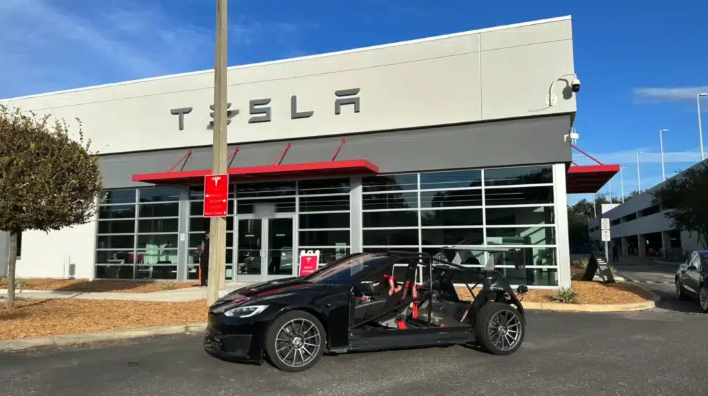 E-Roy is a heavily modified 2022 Tesla Model S Plaid with 1K lbs removed, minus a roof, doors, and rear body, but is the world’s fastest quarter mile Tesla