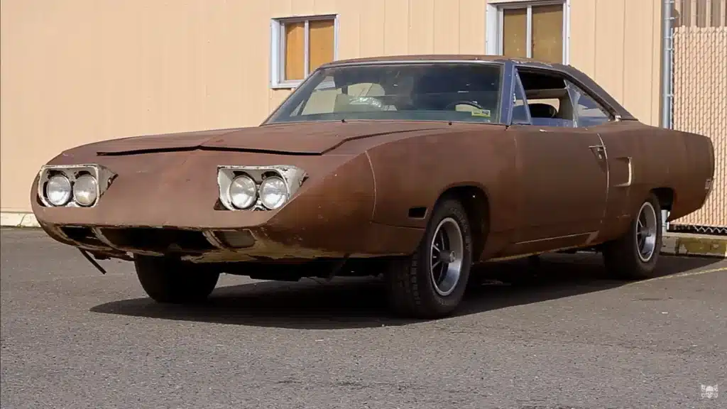 Father and son wait decades for Plymouth Superbird after hearing urban legend a scary man in town had one