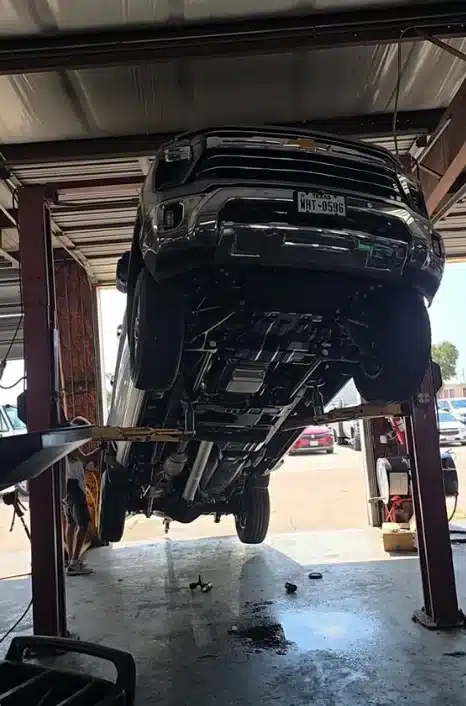 Skipped shake test goes viral after Chevrolet pickup truck fell off mechanic's lift
