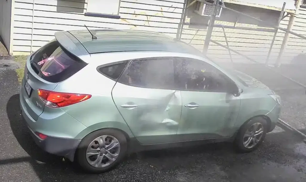 Man delivers instant karma with his sprinklers for any drivers who try and park in his shop's driveway