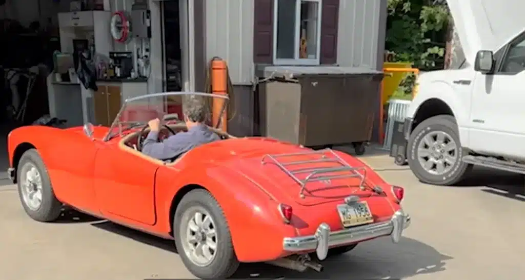 Family bring grandfather to tears of joy after surprising him by fixing up his beloved 1956 MG sports car
