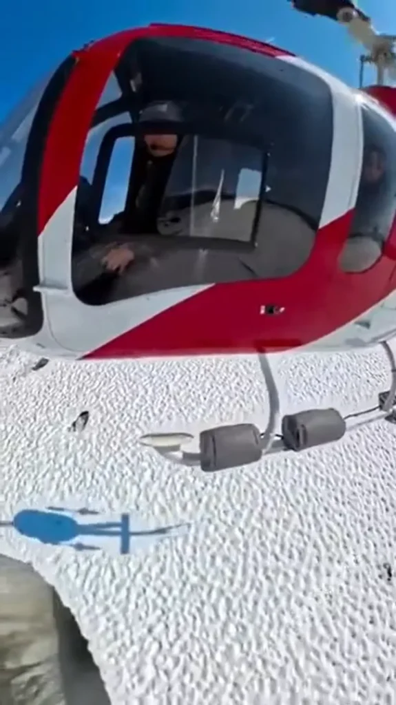 Alaskan helicopter pilot shows off freaky 'bottomless' holes in melting glaciers