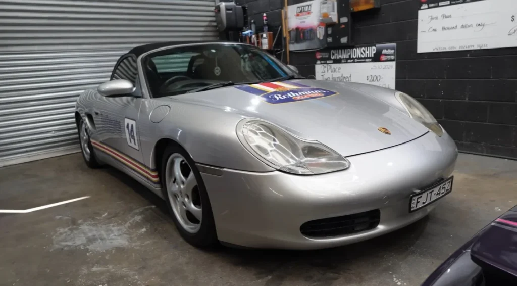 A builder is using 3D printing to recreate a Porsche GT3 RS from a Porsche Boxster base, relying on consumer-grade $500 printers