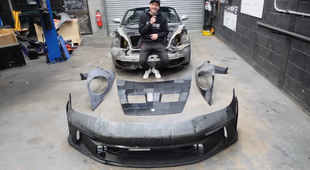 A builder is using 3D printing to recreate a Porsche GT3 RS from a Porsche Boxster base, relying on consumer-grade $500 printers