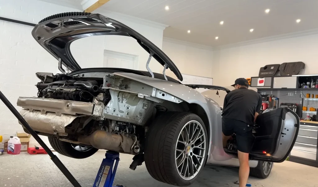 A Porsche 911 with lightning damage from a salvage auction became a long repair saga with gearbox failures, high costs, and hidden electrical faults