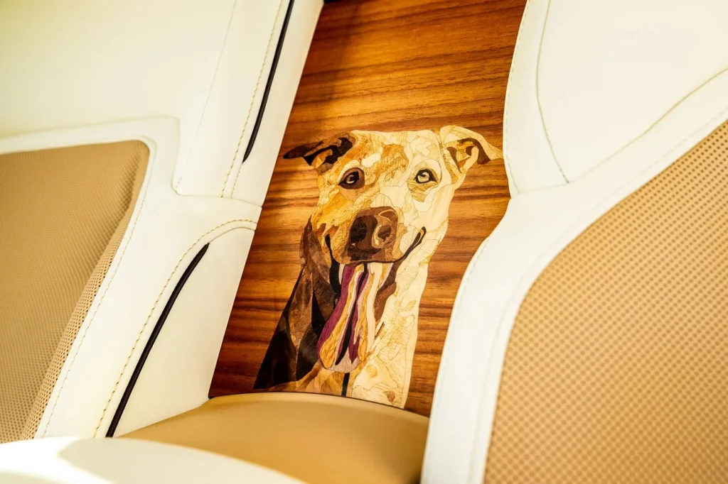 The custom Rolls-Royce Spectre Bailey is a bespoke commission that honors a Labrador-Golden Retriever mix with handcrafted detail