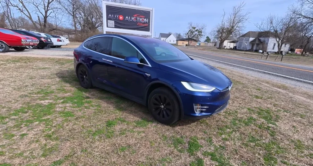 This used Tesla deal for a 2016 tesla model x reveals the current market value and long-term mechanical reality of a high-mileage electric SUV in 2026