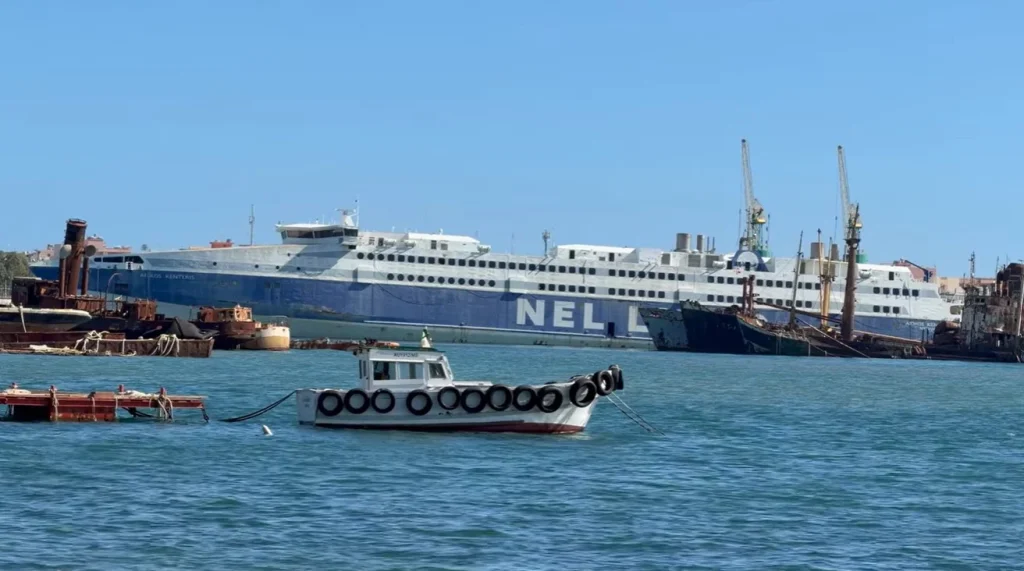 Explore why massive passenger ships and ghost ships like the Aeolos Kenteris high-speed ferry are currently left rotting in Italy within this deep industrial harbor