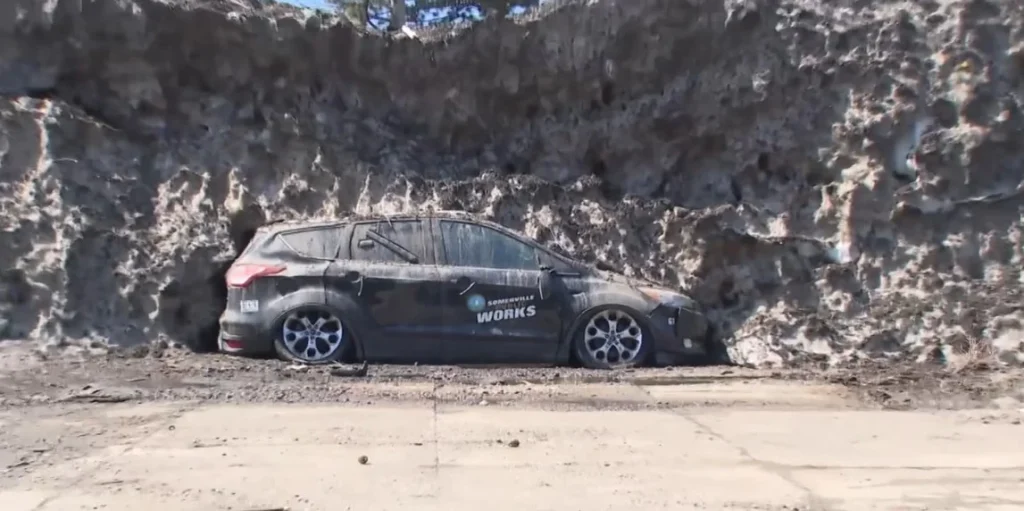 Local residents are shocked to see city vehicles in Somerville finally emerging from a massive snow pile as the winter weather transitions into the spring melt