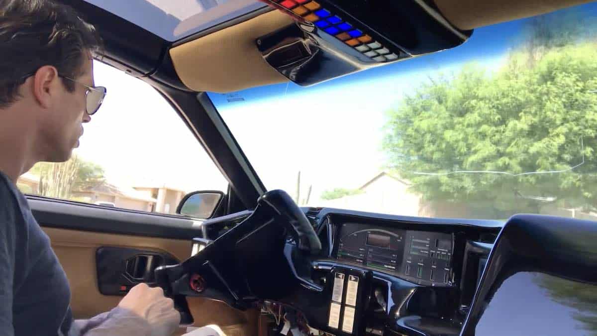 Man sitting in self-driving KITT replica