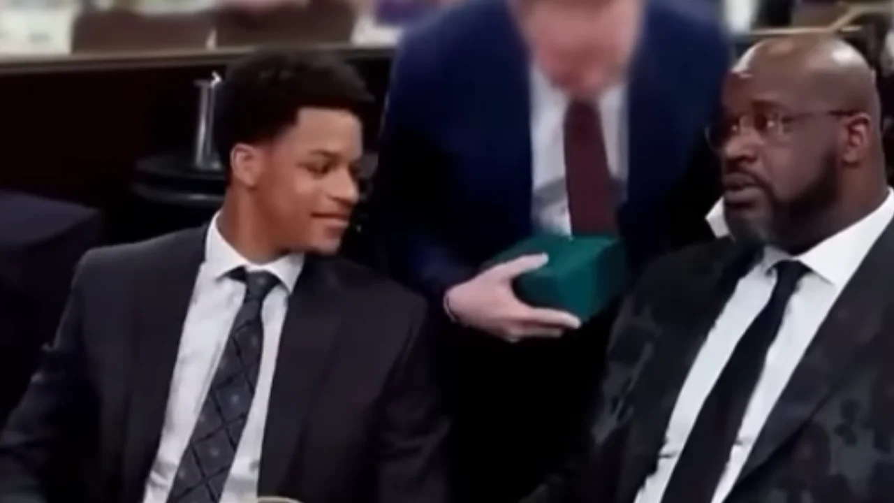 Shaquille O'Neal goes to an auction just to help drive up the price but it backfires as he accidentally buys his son a Rolex