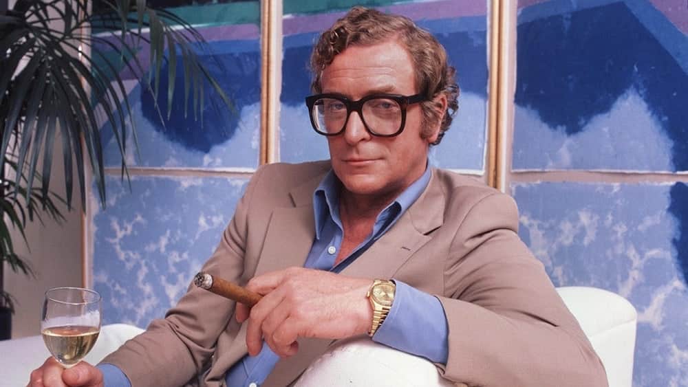 Sir Michael Caine posing with his Rolex Oysterquartz