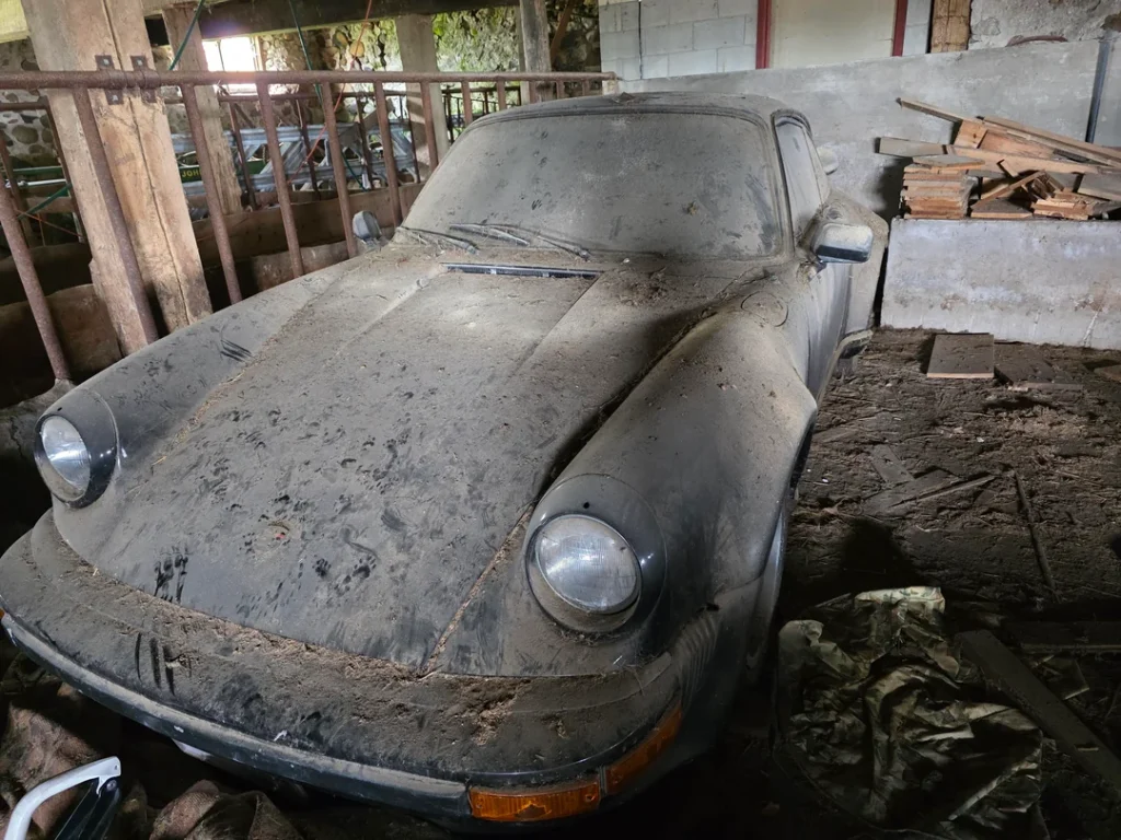 Somebody found a rare and abandoned Porsche in an old barn, and people have two questions