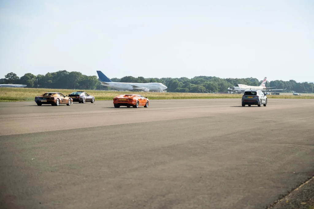Somebody organized a drag race between a Ferrari Testarossa, a Lamborghini Countach, a Porsche 944 Turbo, and a modern Škoda EV