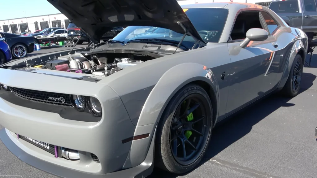 Somebody raced a Toyota 2JZ-swapped Dodge Challenger Hellcat against a twin-turbo Challenger around Pocono Raceway in Pennsylvania, and the result was interesting
