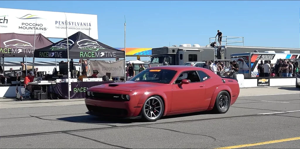 Somebody raced a Toyota 2JZ-swapped Dodge Challenger Hellcat against a twin-turbo Challenger around Pocono Raceway in Pennsylvania, and the result was interesting