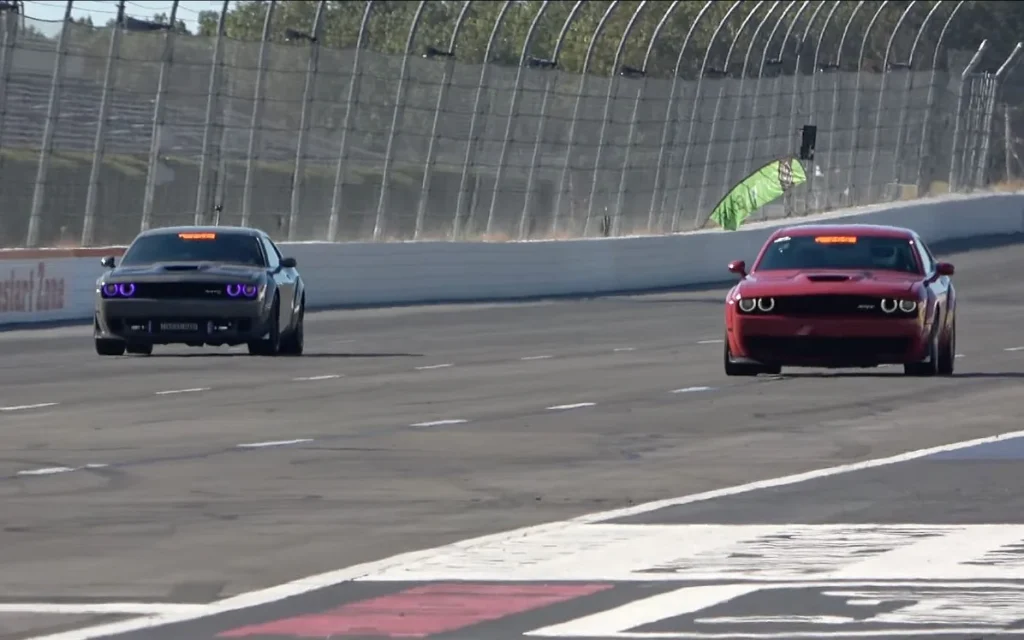 Somebody raced a Toyota 2JZ-swapped Dodge Challenger Hellcat against a twin-turbo Challenger around Pocono Raceway in Pennsylvania, and the result was interesting