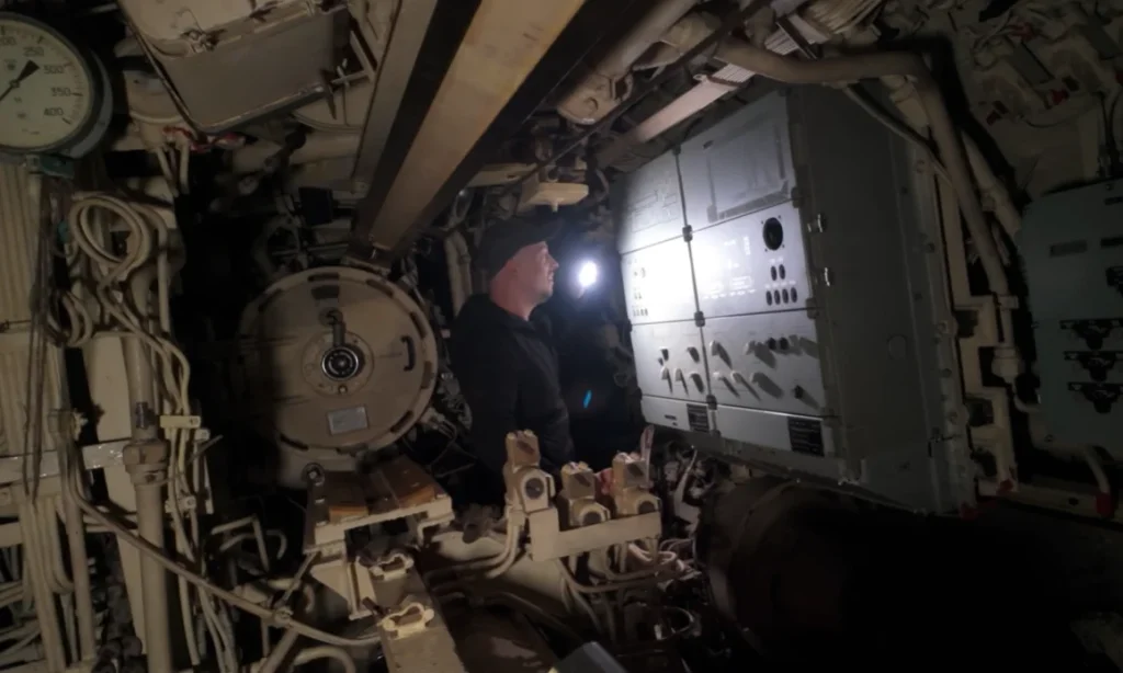 Couple sneak inside an abandoned Soviet-Chinese submarine and what they find is as wild as you'd expect