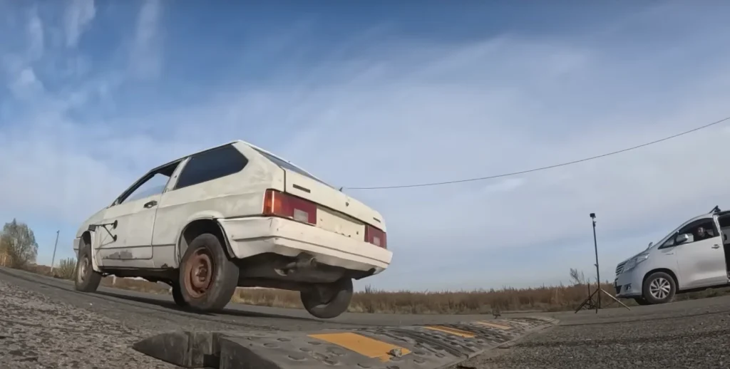 Man tests out driving over a speed bump at high speeds to see what actually happens
