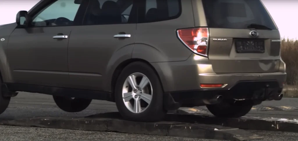 Man tests out driving over a speed bump at high speeds to see what actually happens